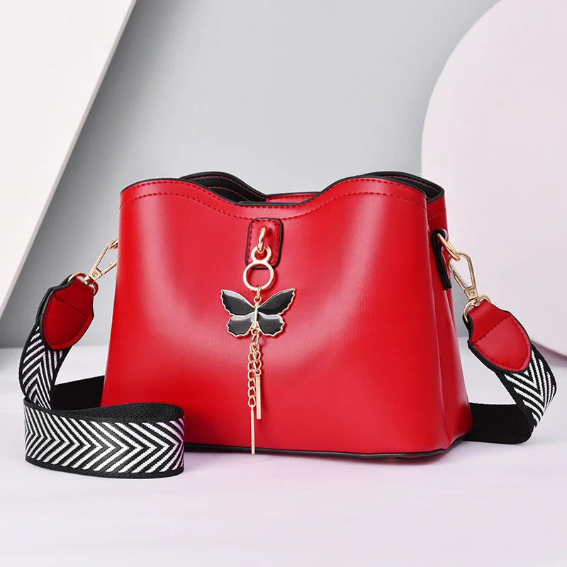 Bolso de mano con borla de mariposa