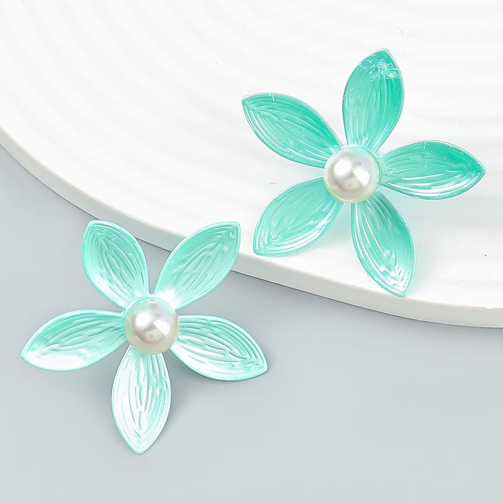 Pendientes de flor de metal con perla